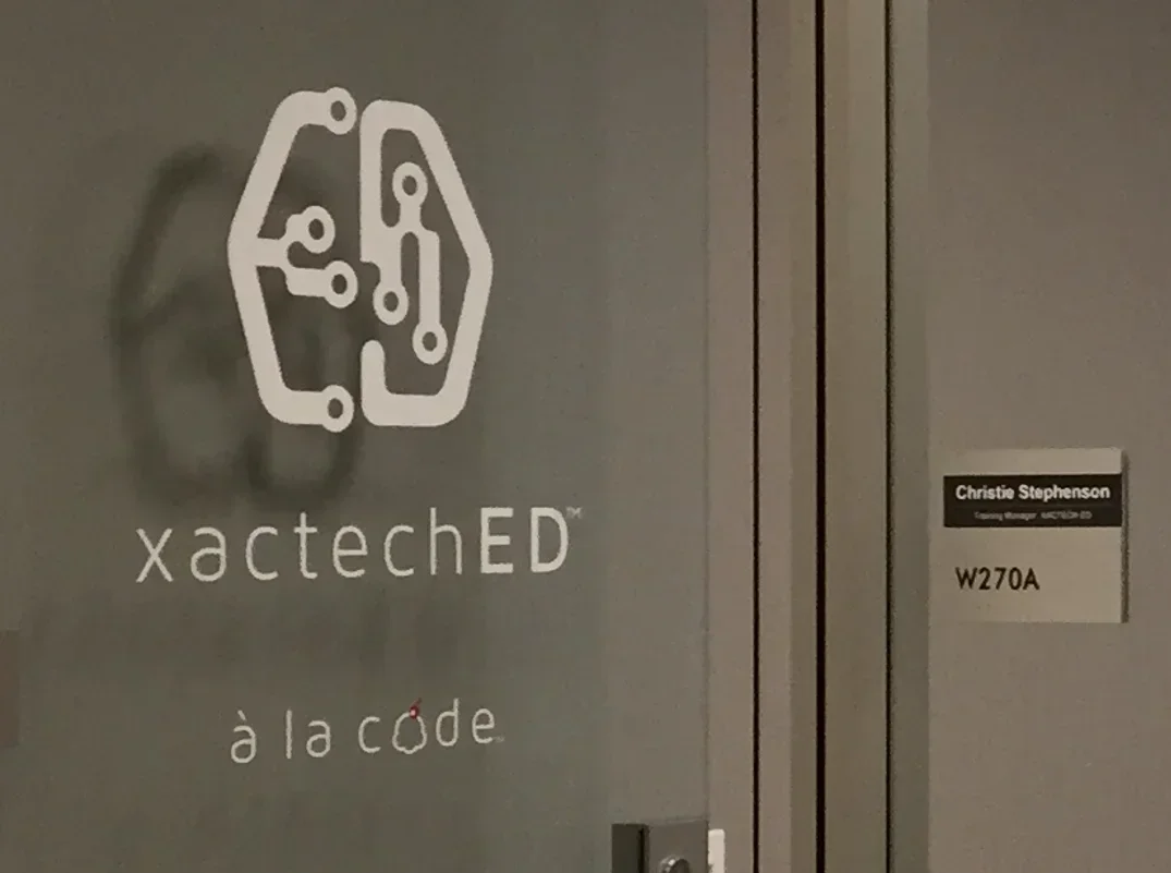 Office door showing xactechED branding